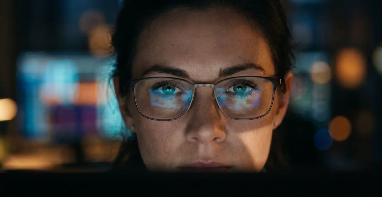 Close-up of security analyst's concentrated expression while monitoring threat detection systems